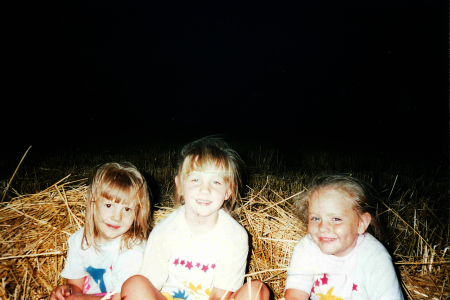 Jordan and her cousins in a wheat field. 
