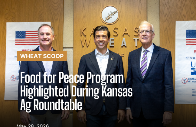 Congressman Mann, Under Secretary Lindberg and Senator Moran standing in front of the Kansas Wheat sign following the press conference.