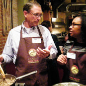 Lance Rezac, Onaga farmer, talks with La’Shonda Woodard, blogger at www.fashionplatekc.com, while they prepare a meal together. The topic of genetically modified organisms (GMOs) was one topic of discussion.