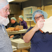 Photo: Eric Sperber and Marsha Boswell evaluate gluten strength with the window pane test.