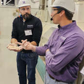 Photo: Romulo Lollato learns about flour milling from instructor Shawn Thiele.