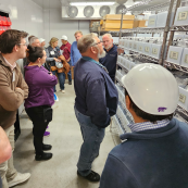 Photo: Participants tour the Wheat Genetics Resource Center, housed in the Kansas Wheat Innovation Center.