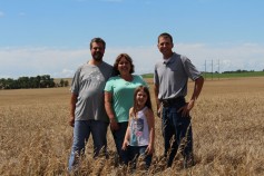 Photo: Wilson family with Justin Knopf in wheat field.