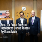 Congressman Mann, Under Secretary Lindberg and Senator Moran standing in front of the Kansas Wheat sign following the press conference.